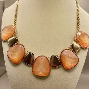 Iridescent orange gemstone and gold alloy acrylic collar necklace. 17 inch long